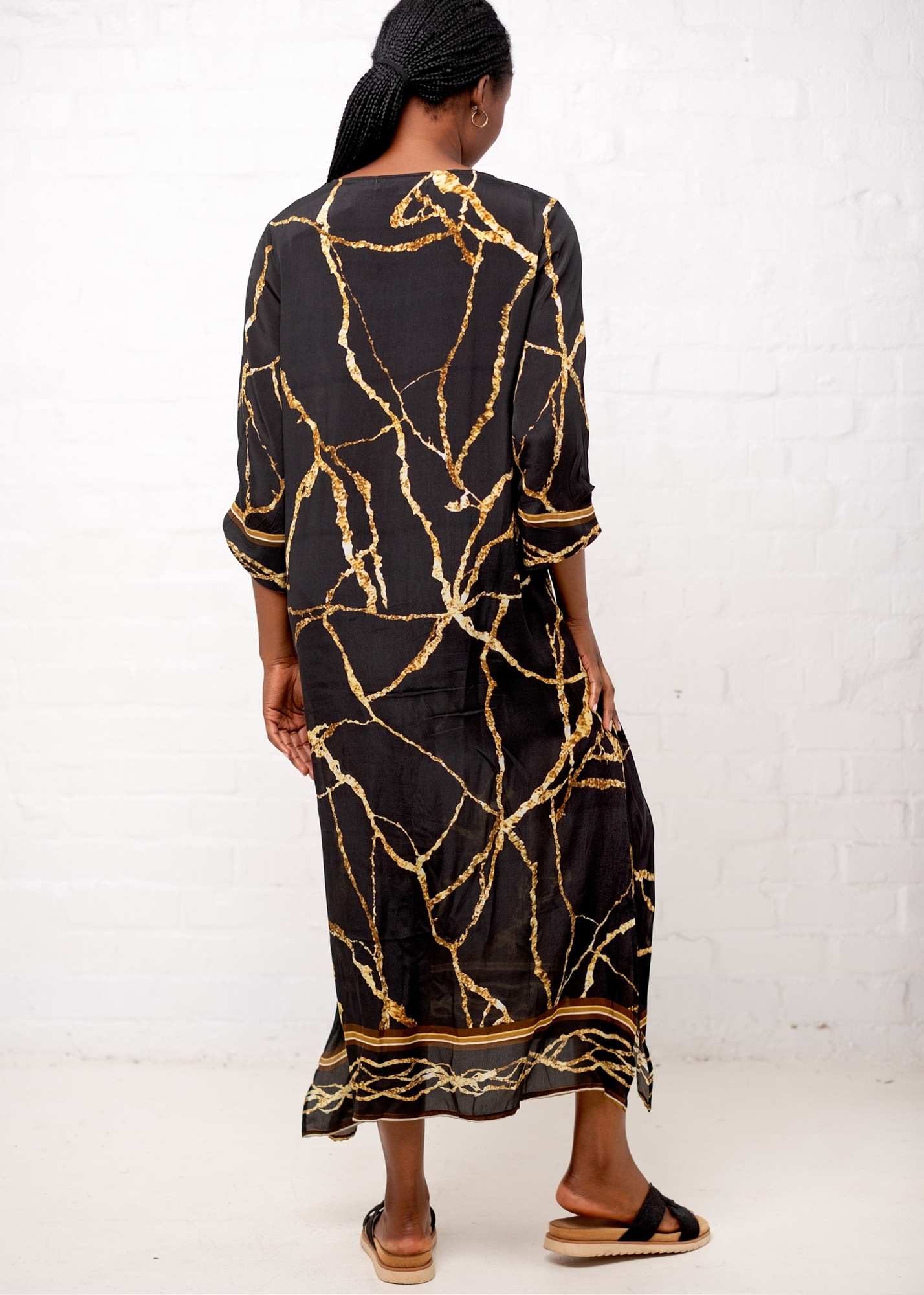 Gloria Dress with Tucked Sleeve Detail in Black and Gold Marble