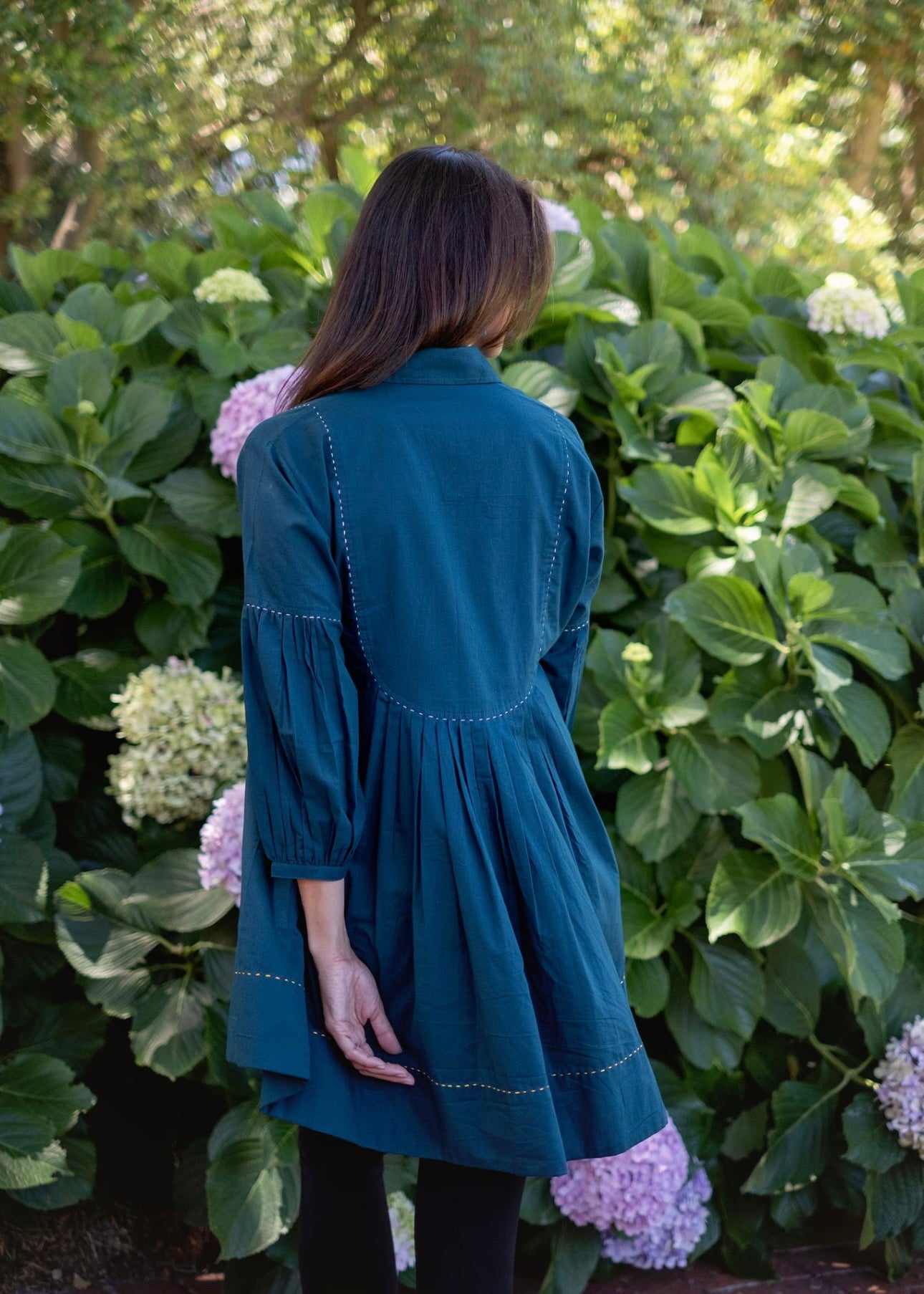 Pleated tunic with saddle stitching, Teale