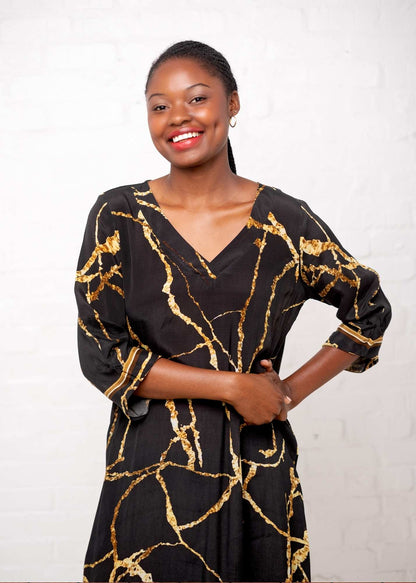 Gloria Dress with Tucked Sleeve Detail in Black and Gold Marble