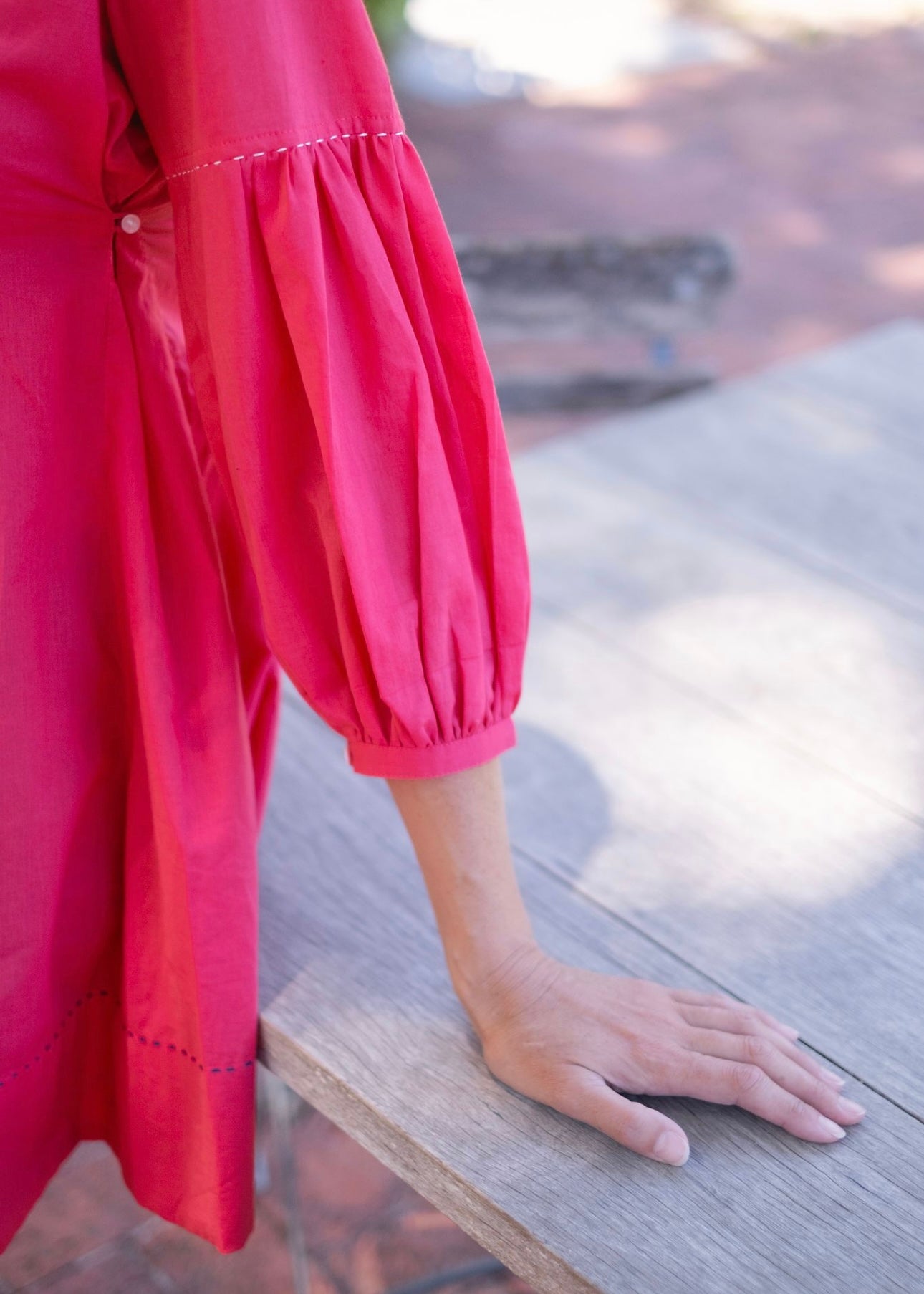 Pleated tunic with saddle stitching, Cerise